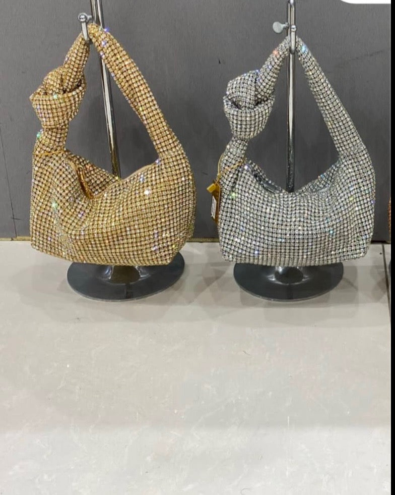 A DIAMANTÉ KNOT GOLD LARA LUXURY BAG .